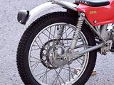 a red motorcycle that is parked in a parking lot