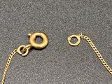 gold plated bracelet with a heart charm on a chain