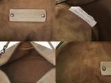 three pieces of brown sued purses with zippers on them