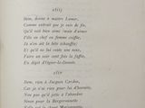 a book with a poem written in it on a table