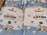 six packs of cotton baby diapers in a box on a table