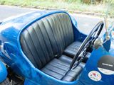 a blue car that is parked on the side of the road