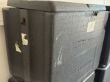 three boxes stacked on top of each other in a room