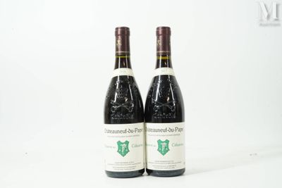 two bottles of wine sitting next to each other on a white surface