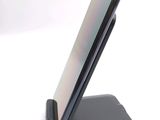 a cell phone that is sitting on top of a stand