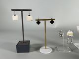 three different types of jewelry on display on a table