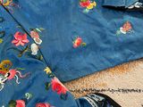 two pieces of clothing on a rug on the floor