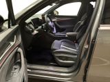 the interior of a car with the door open and the driver ' s seat up