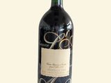a bottle of wine that is sitting on a table
