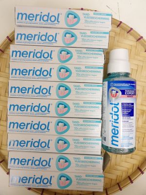 several boxes of merrolol and a bottle of water on a basket