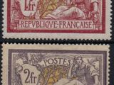 a couple of stamps that are sitting on top of each other