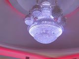 a chandelier hanging from the ceiling in a restaurant