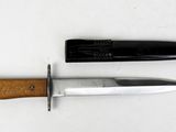 two knives that are laying next to each other on a table