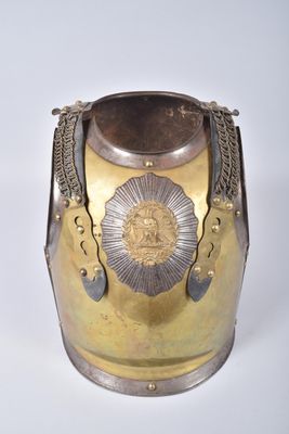 a silver and gold vase with a gold star on it