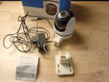 a camera that is sitting on a table next to a box