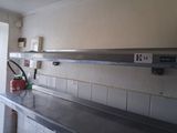 a fire extinguisher sitting on the counter in the kitchen