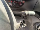 a close up of a car ' s dashboard with a steering control