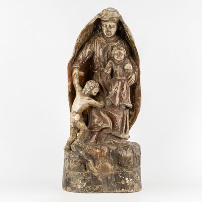 a statue of a woman holding a child in her arms