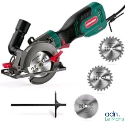 the green circular saw is being used to cut a piece of wood
