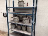 a metal shelf with a lot of gas cans on it