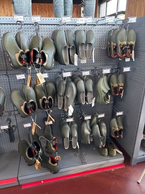 a lot of helmets that are on display in a store