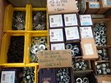 a box full of assorted nuts and screws