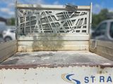 a close up of a truck bed with a broken window