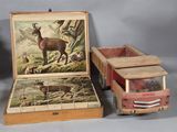 two boxes with pictures of animals on them and a box with a lid