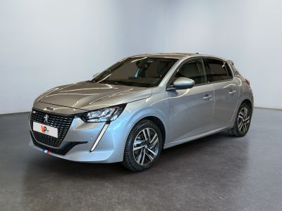 a silver car is parked in a room with a white wall