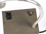 a close up of a metal object with wires attached to it
