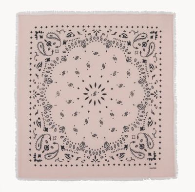 a pink banda with black and white designs on it