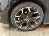 a close up of a tire on a car ' s rim