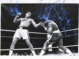 photograph of two boxers fighting in a boxing ring with blue splats