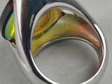 sterling silver ring with multi colored glass in the center