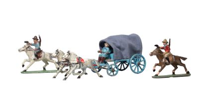 four figurines of people riding in a horse drawn carriage