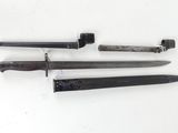 three different types of knives are displayed on a white surface