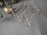 a silver candle holder that is sitting on a table