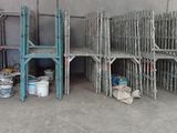many chairs that are stacked up in a room