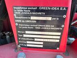a picture of a red tractor with a sign on the back of it