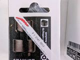 a white box with a pair of black and white tape in it