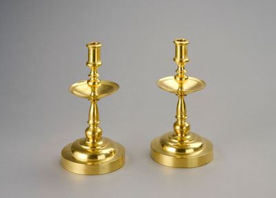 pair of brass candlesticks with candlestick holders