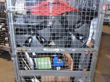 a metal cart with many items in it in a warehouse