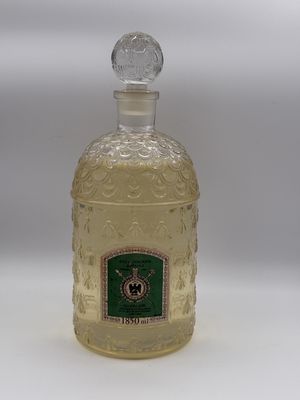 an image of a bottle of alcohol sitting on top of a white table