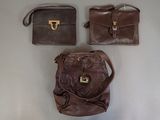 three bags that are sitting on a table