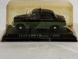 a black and green car in a clear box