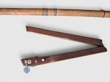 two different types of baseball bats on a white surface