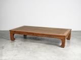 an image of a wooden coffee table on a concrete floor