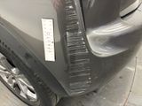 a close up of a car with a sticker on it ' s bumper