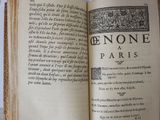 an open book on a table with a picture on it