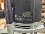 a close up of a black and silver electric drill